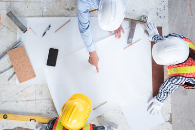 High angle view of architecture guiding colleagues while working