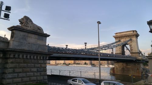 View of bridge over river in city