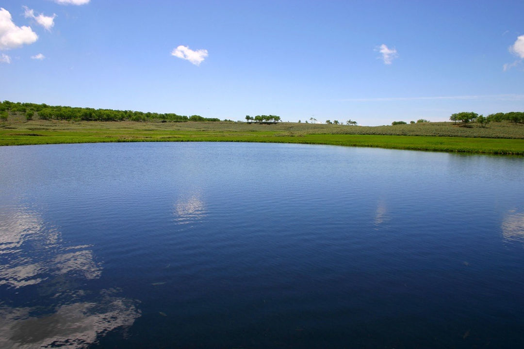 water, tranquil scene, tranquility, sky, scenics, lake, reflection, beauty in nature, nature, grass, cloud, landscape, tree, cloud - sky, waterfront, river, rippled, idyllic, outdoors, day