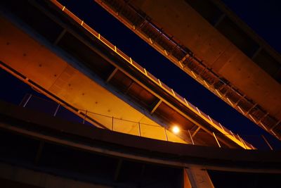 Low angle view of illuminated built structure against sky