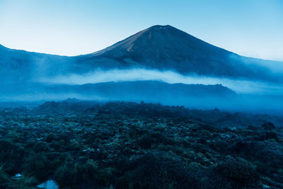 Aerial view of volcanic landscape against sky