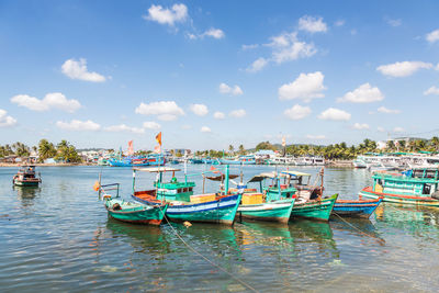 Boats moored at shore in asia