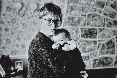 Portrait of father with son standing on floor