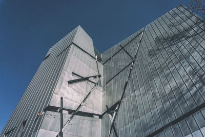 Low angle view of building against clear blue sky during sunny day