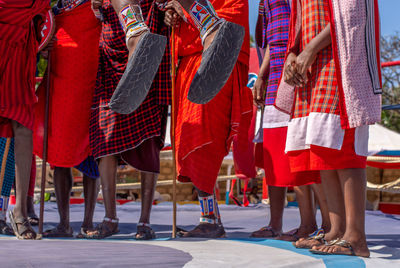 Low section of people in traditional clothing standing