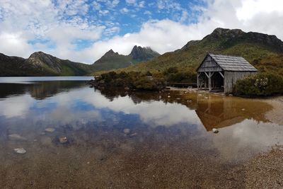 Scenic view of lake and mountains against sky