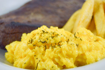 Close-up of yellow food in plate