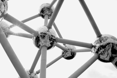 Low angle view of metallic structure against sky