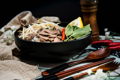 Close-up of food on table against black background