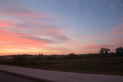 Scenic view of silhouette landscape against sky at sunset