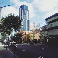 View of city street against buildings