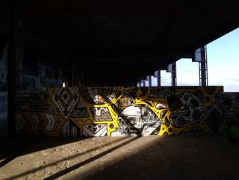 Graffiti on bridge against building