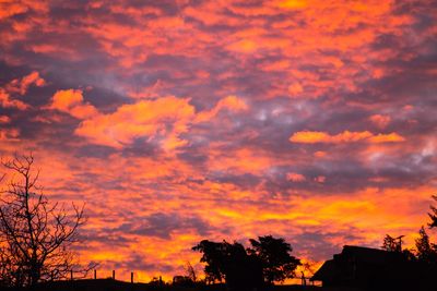 Low angle view of dramatic sky during sunset