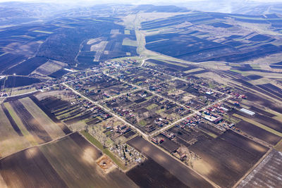 Aerial view of a square shaped village settlement from a drone