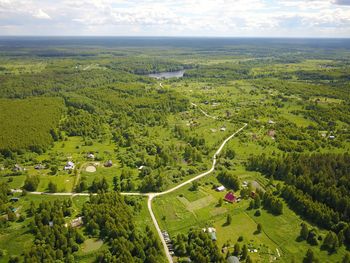 High angle view of field against cloudy sky