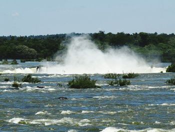 View of waterfall against clear sky