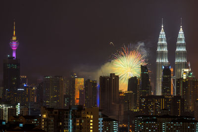 High angle view of firework display over cityscape