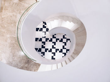 High angle view of chess on white table