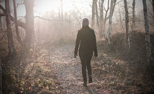 Man standing in forest during winter