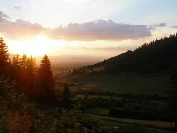 Scenic view of landscape against sky during sunset