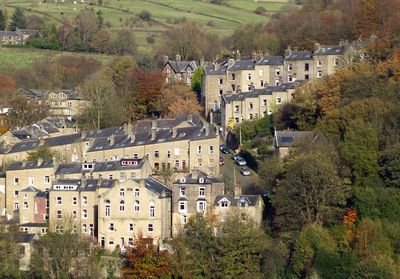 High angle view of houses in town against sky