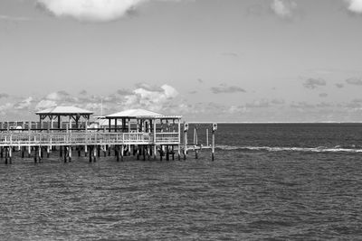Pier over sea against sky