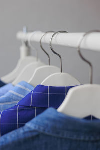 Close-up of clothes hanging on rack