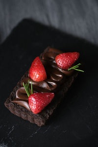 High angle view of strawberries on table