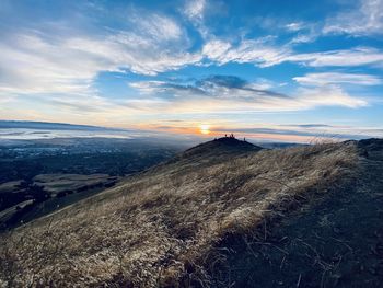 Scenic view of landscape against sky during sunset