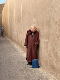 Rear view of woman walking on street