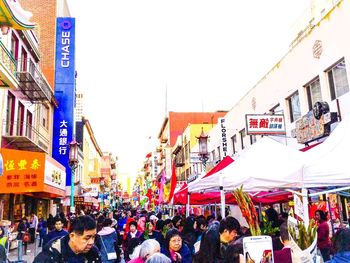 People on sidewalk in city