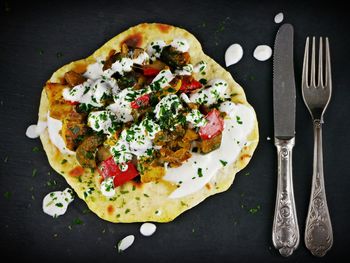 High angle view of pizza in plate on table