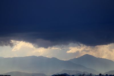 Scenic view of mountains against sky at night