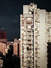 Buildings in city at night