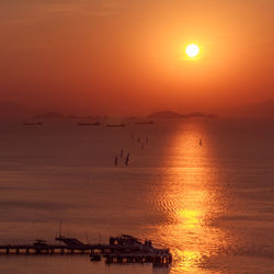 Scenic view of sea against orange sky