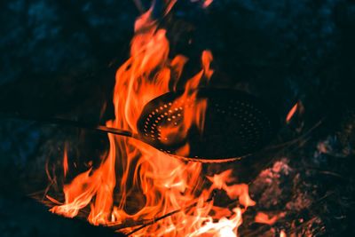 Close-up of burning fire on wood