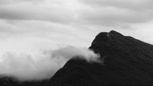 Scenic view of volcanic mountain against sky