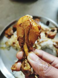 Close-up of hand holding ice cream