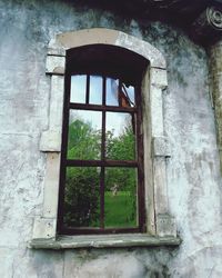 Low angle view of window in old building