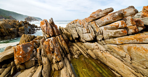 Panoramic view of rock formations against sky