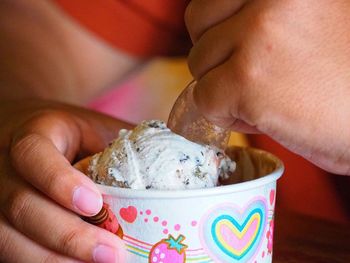 Midsection of person holding ice cream