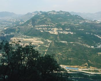 Scenic view of tree mountains against sky