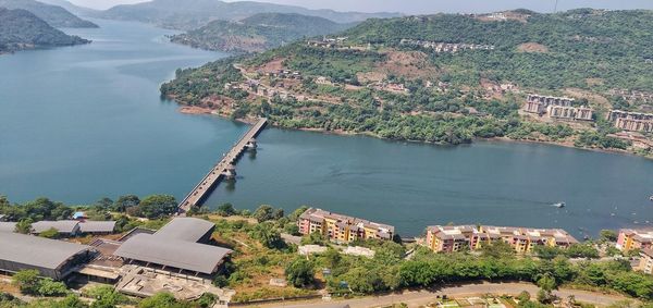 High angle view of river by buildings in city