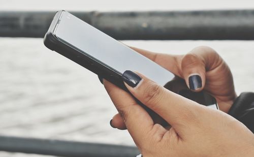 Close-up of person using mobile phone