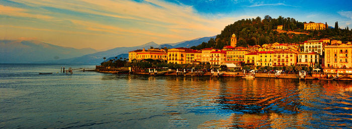 Scenic view of sea and buildings against sky