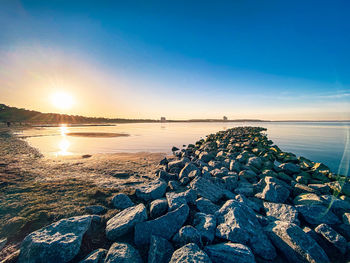 Scenic view of sea against sky during sunset