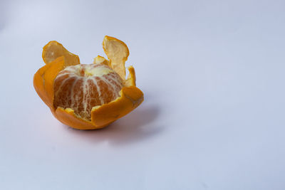 High angle view of orange on table against white background
