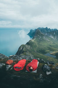Scenic view of sea and mountains against sky