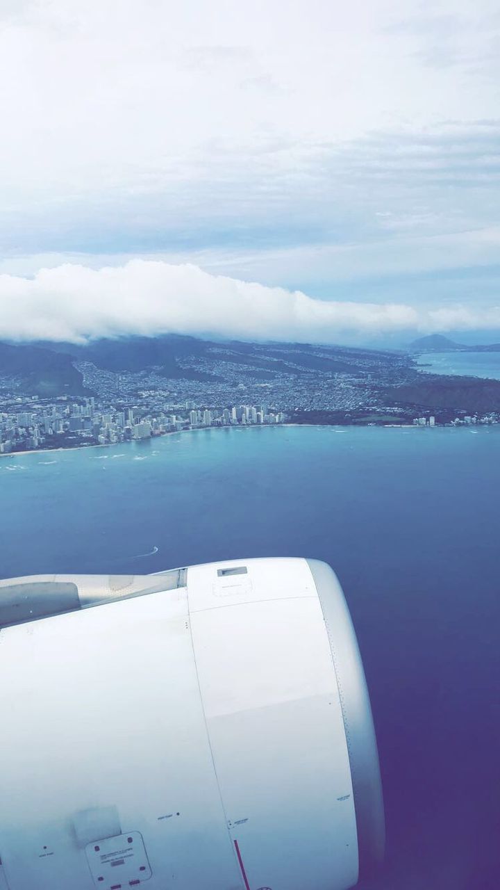 VIEW OF SEA FROM AIRPLANE WING