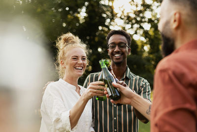 Smiling man standing in a drinking glass